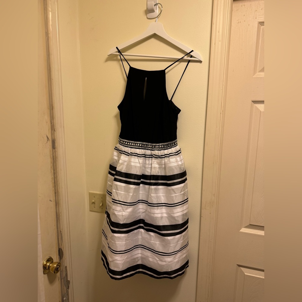 Nice dress with black top and striped skirt.
